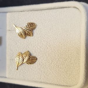 Gold tiny leaf earrings.